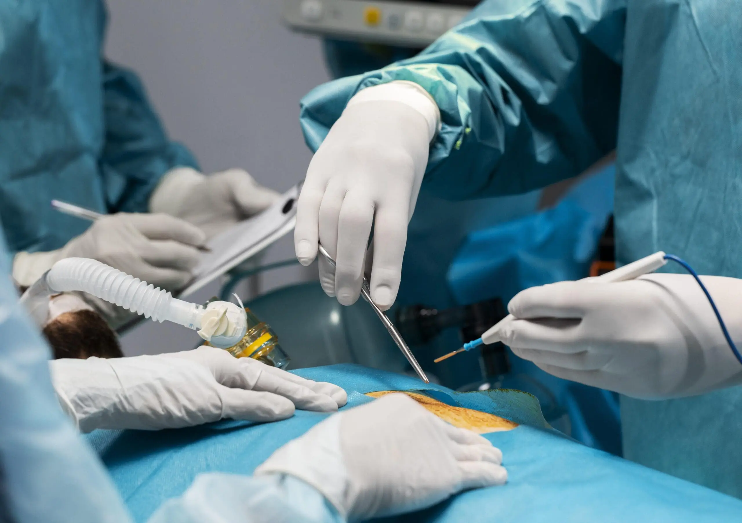 doctors doing surgical procedure patient scaled