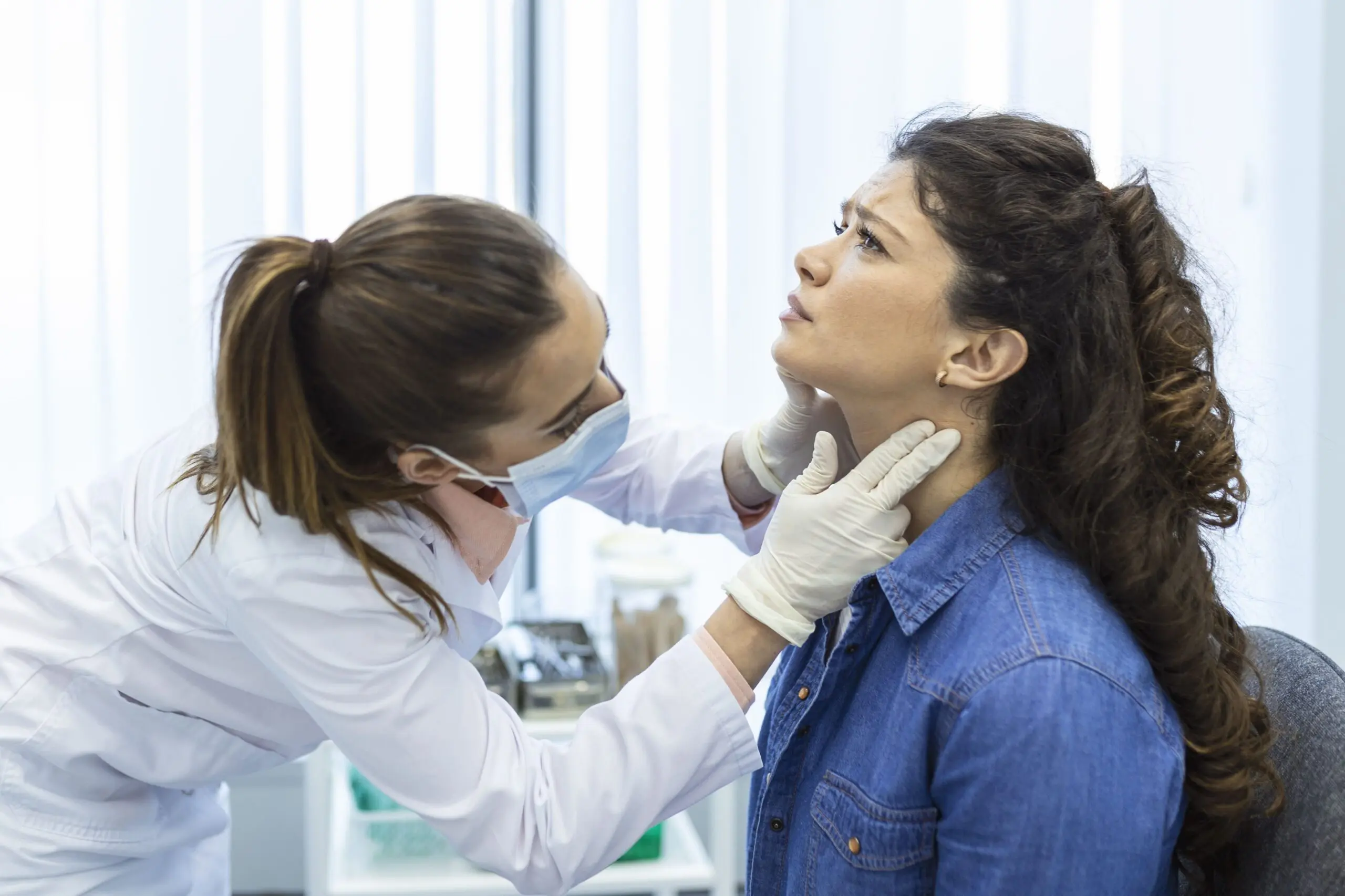 endocrinologist examining throat young woman clinic women with thyroid gland test endocrinology hormones treatment inflammation sore throat scaled