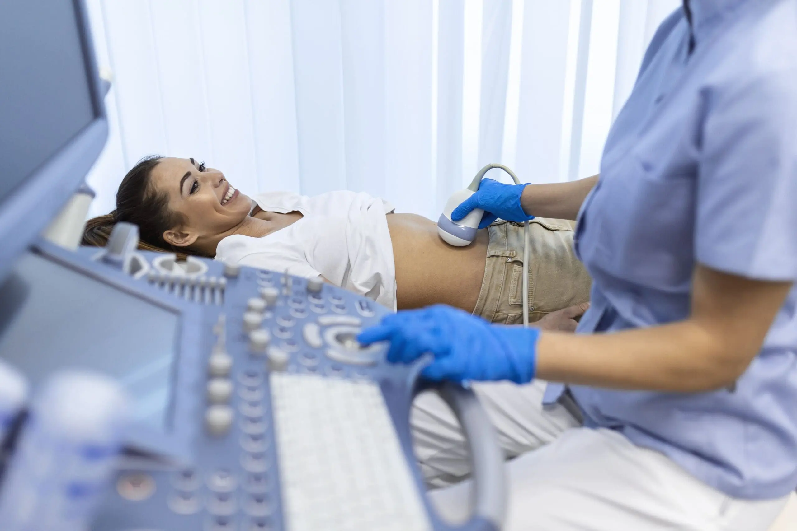 ultrasound diagnostic stomach abdominal woman clinic closeup view doctor runs ultrasound sensor patient s girl tummy looks image screen diagnosis internal organs scaled